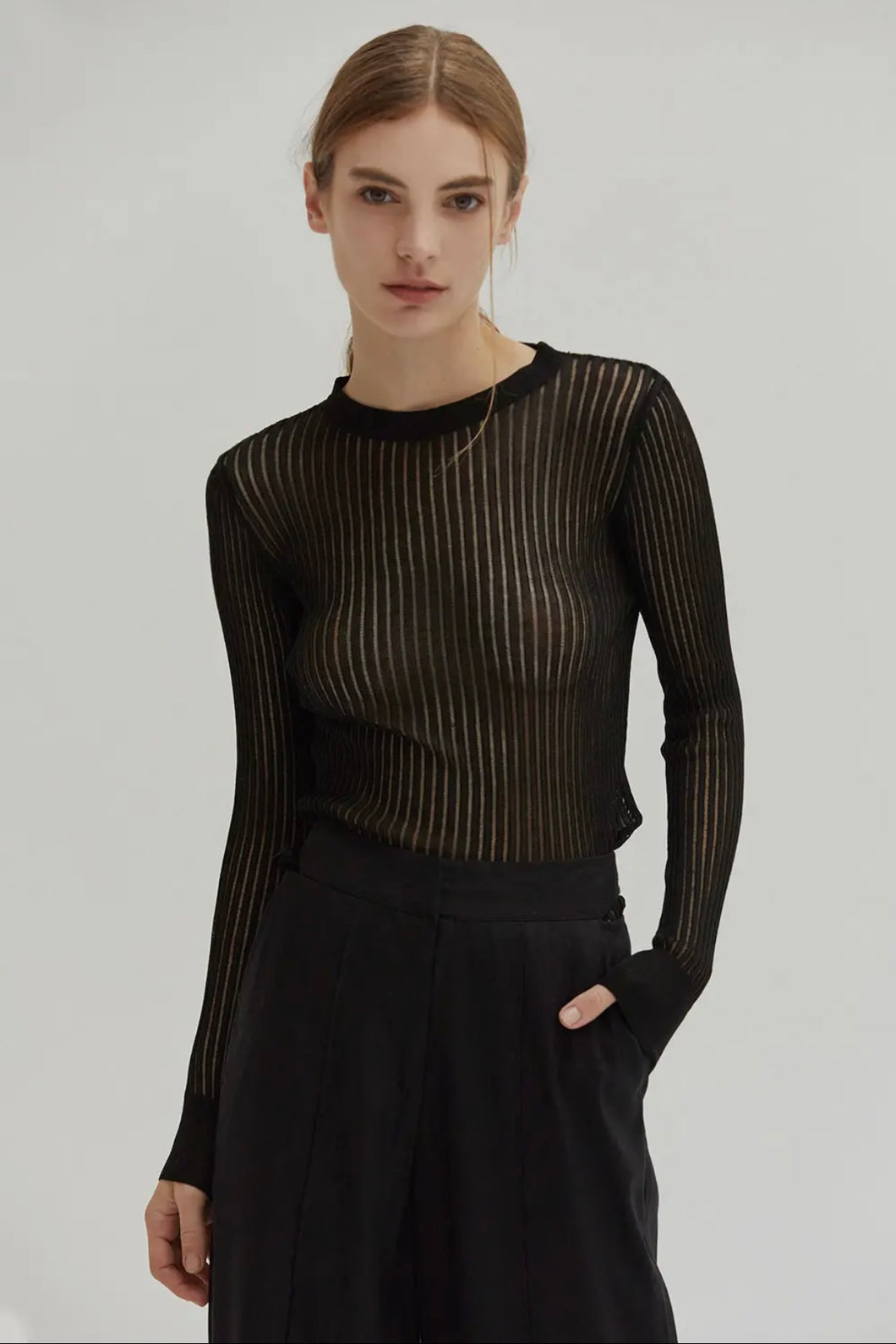 The Christina Semi Sheer Ribbed top is the perfect addition to your Fall wardrobe. A must have elevated basic to add to your core collection.  

﻿﻿Ribbed sheer knit
﻿﻿Crew neckline
﻿﻿Long sleeve
﻿﻿Slim fit