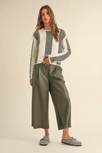 Load image into Gallery viewer, These Vegan Leather pants are going to take you into next year! Dress them up or down, wear them with flats or boots. The flattering wide leg keeps you comfortable while looking ultra cool.  Also available in black!

Vegan leather fabric
Front zip and button closure
Mid rise&nbsp;
Pleating detail in front
Side pockets
Cropped length